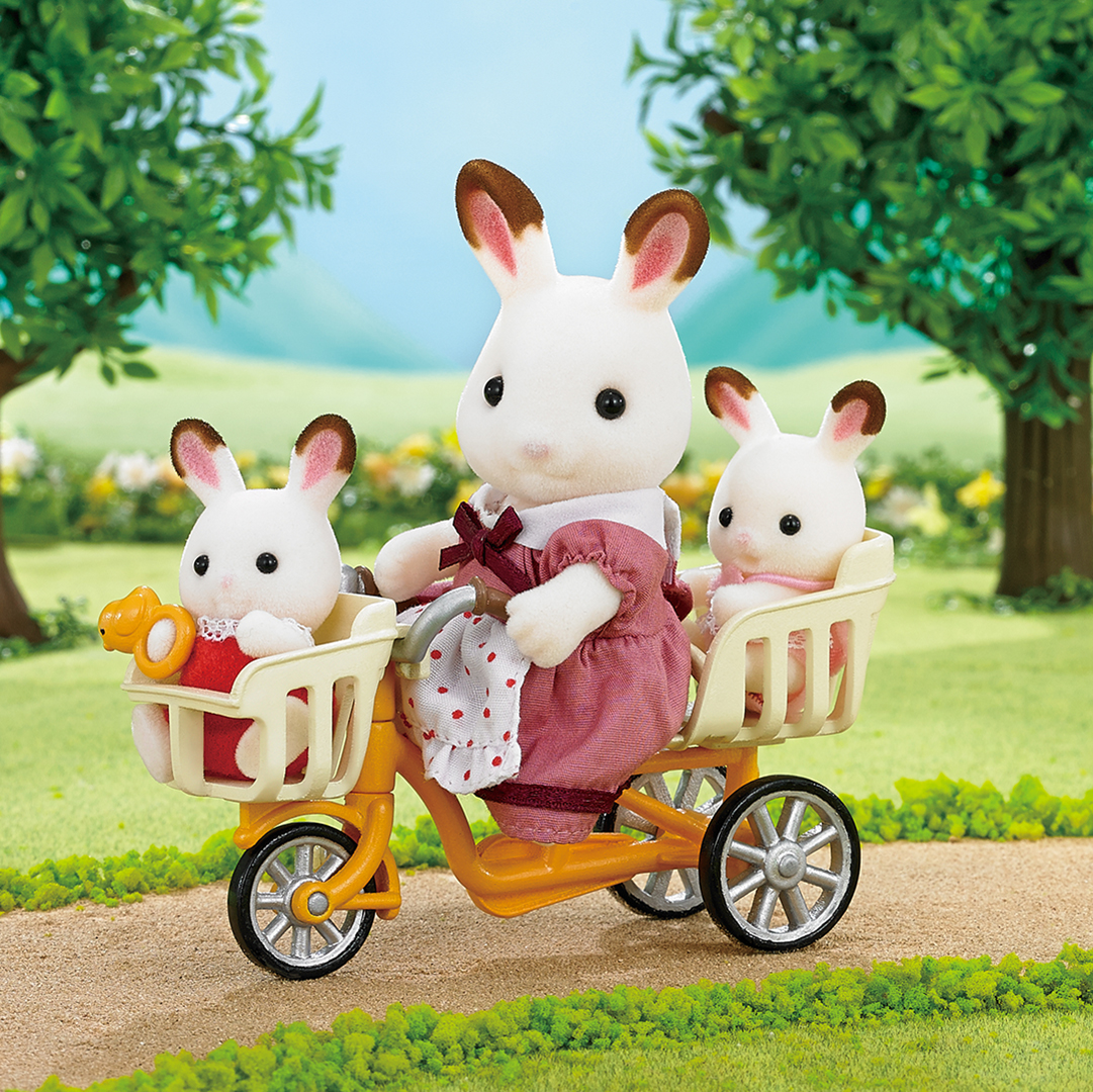 sylvanian rabbits on a bike